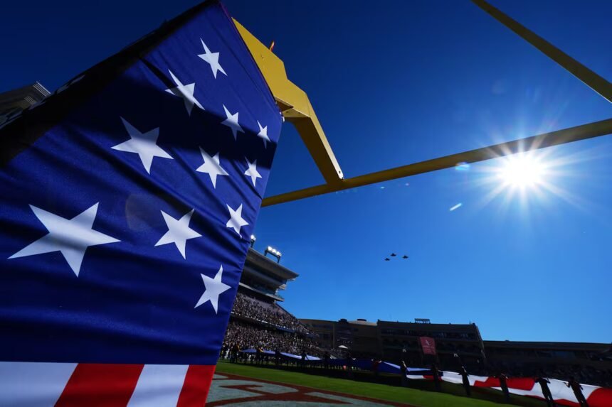 Parachutist at Armed Forces Bowl gets caught in wire, falls into crowd