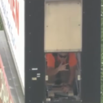 Man gets stuck inside truck stop sign during service call