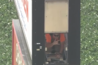 Man gets stuck inside truck stop sign during service call