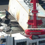 Truck overturns swerving to avoid traffic, fatally flattening car