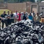 Truck driver calls 911 on own load after load shift reveals packages of marijuana