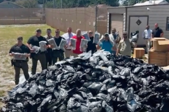 Truck driver calls 911 on own load after load shift reveals packages of marijuana