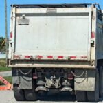 Dump truck placed OOS after officer finds no front brakes at all during inspection
