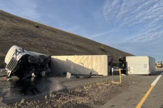 Driver hauling triple trailers arrested for intoxication, endangerment after wrecking