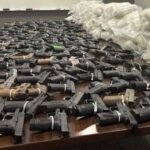 CMV traffic stop leads to discovery of 174 handguns with scratched serial numbers & massive bundles of heroin