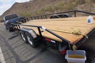 Arizona troopers seize 106 gallons of liquid meth from frame of pickup truck's towed trailer