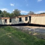 Driver with no CDL charged after getting manufactured house stuck on Mississippi roadway