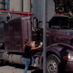 Midwestern truck drivers handed free lunches while waiting in line to drop off their harvests