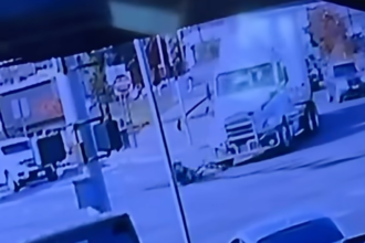 Biker flattened by turning semi truck in incident caught on surveillance camera