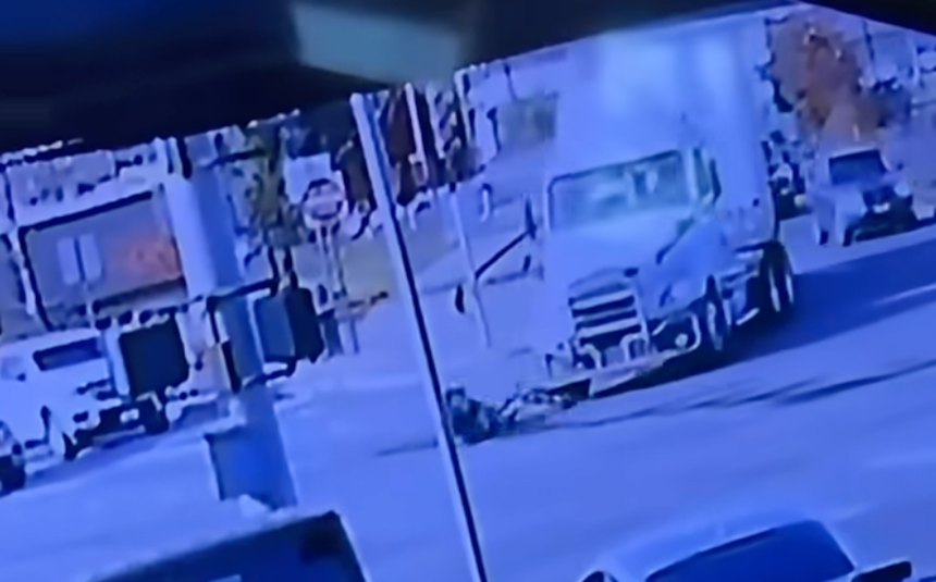 Biker flattened by turning semi truck in incident caught on surveillance camera