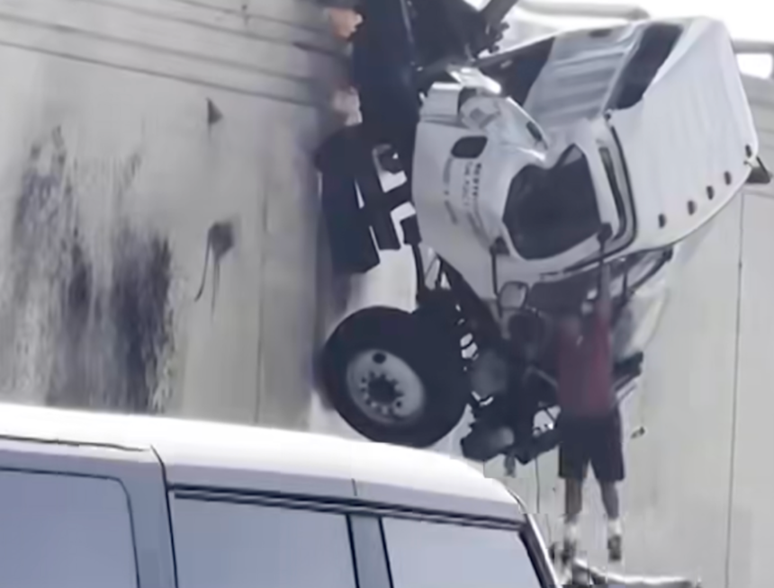 Watch this truck driver jump from a dangling truck cab as good samaritans try to help